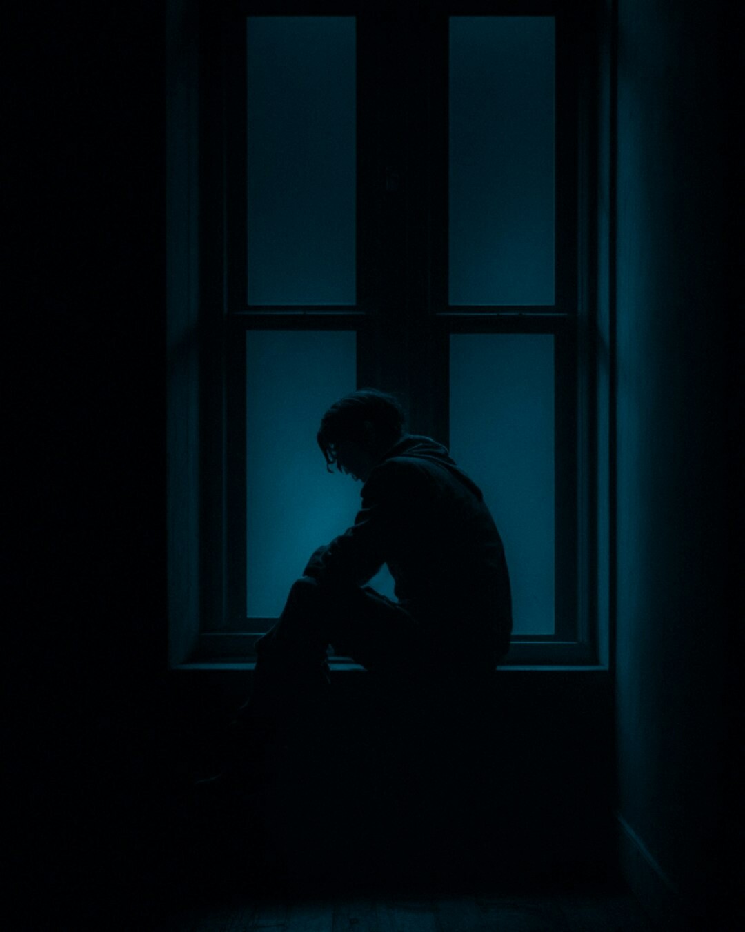 shadowy figure in dark room